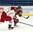 SPISSKA NOVA VES, SLOVAKIA - APRIL 23: Latvia's Rudolfs Builis #11 lets a shot go while Ilya Gurban #14 of Belarus defends during relegation round action at the 2017 IIHF Ice Hockey U18 World Championship. (Photo by Steve Kingsman/HHOF-IIHF Images)

